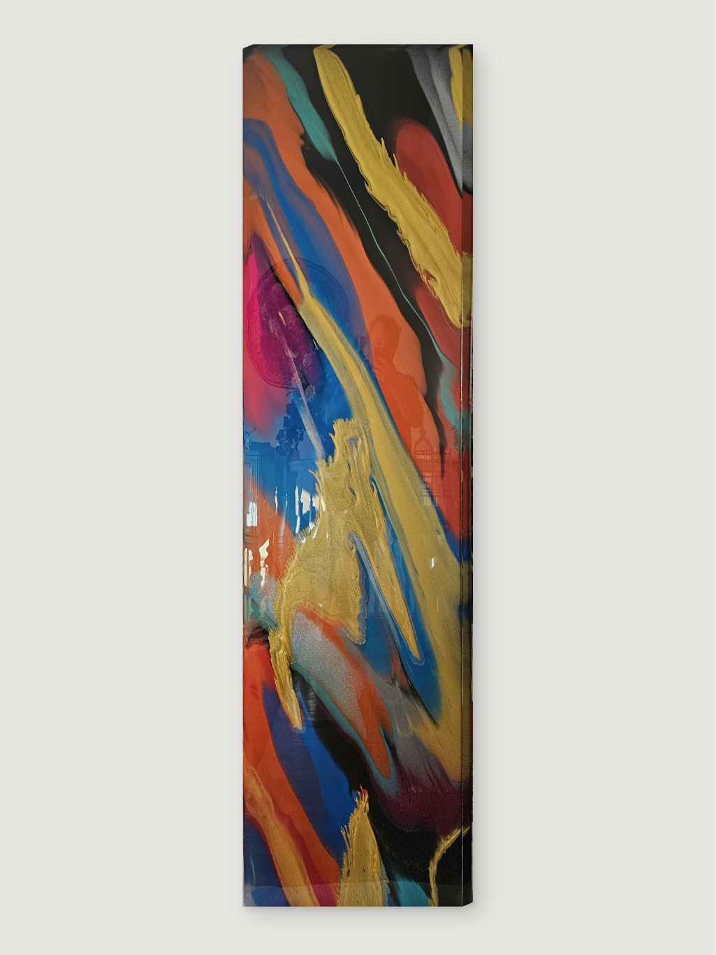 An abstract painting with vibrant colors and dynamic brushstrokes is displayed against a plain white wall.