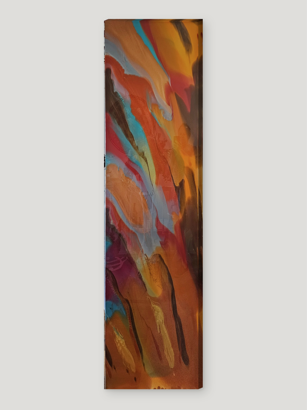 An abstract painting with warm colors and dynamic brushstrokes is displayed against a plain white wall.
